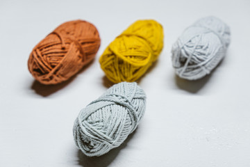 Fototapeta na wymiar Colorful small wool yarns on white background isolated 