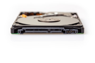 SATA connector on 2.5 inch opened portable hard drive isolated on white background with shallow focus and copy space
