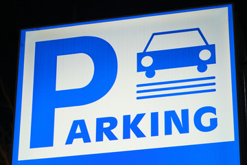 Obraz premium An outdoor parking sign. Blue and white. Car symbol