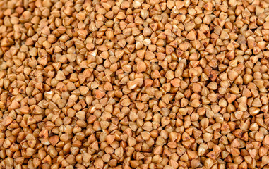 The texture of dry buckwheat. Background image of buckwheat porridge. Maro's Photo