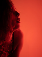 Women with neon red lights, Portrait of beautiful sexy girl