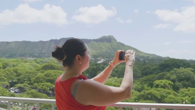 Girl Taking Picture of Honolulu Hawaii island in 4K Slow motion 60fps