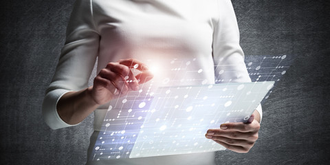 Businesswoman hands using virtual interface