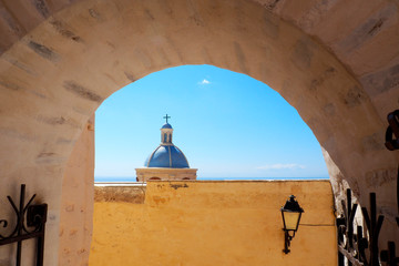 blue dome of the catholic cathedral which dominates the city of Ermopouli, capital of Syros, famous Cyclades island in the heart of the Aegean Sea