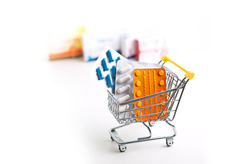 variety of pills in a supermarket trolley