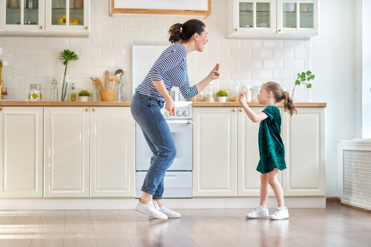 Happy Family In The Kitchen.