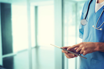 Healthcare And Medicine. Doctor using a digital tablet