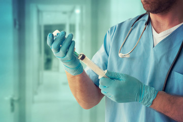 Healthcare And Medicine. Doctor with syringe is preparing for injection