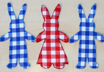 Obraz premium Homemade fabric bunnies holding hands - creative hobby in spring or Easter time