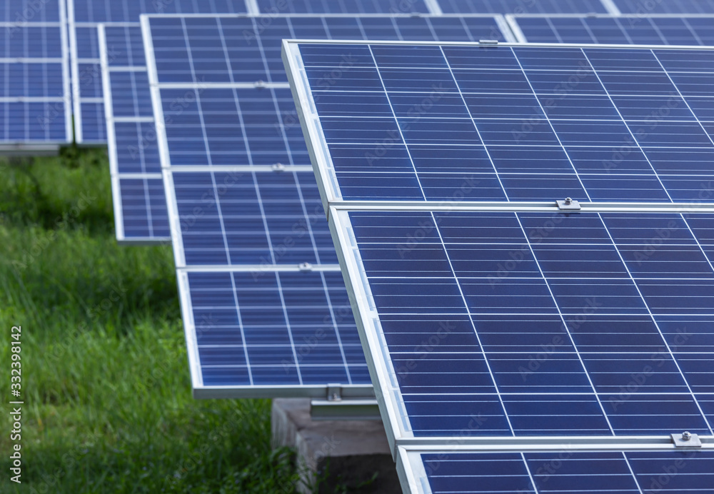 Wall mural polycrystalline silicon solar cells or photovoltaic cells in solar power plant station turn up skyward absorb the sunlight from the sun 