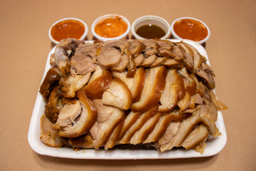 Boiled pig's trotters with sauce (Jokbal). Famous Korean food, delivery food. 