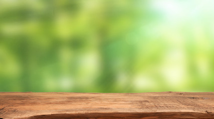 Abstract spring background with flares and a wooden table