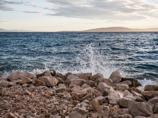 Tide coming on pebble beach in Croatia