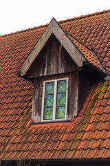 Retro red tile roof of old house