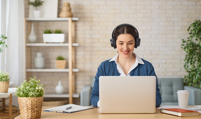 woman working on a laptop at home.
