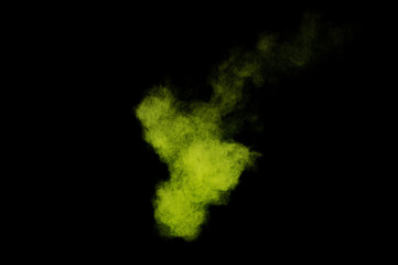 Fototapeta na wymiar Light green powder explosion on black background. Colored powder cloud. Colorful dust explode. Paint Holi.