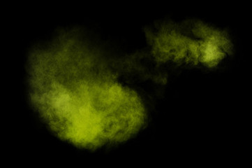 Fototapeta premium Light green powder explosion on black background. Colored powder cloud. Colorful dust explode. Paint Holi.