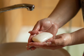 Influenza prevention: Cleaning hands with soap against disease infection versus flu or infulenza,