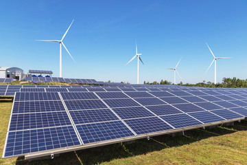solar cells or solar panels or photovoltaic cells with wind turbines generating electricity alternative renewable wind energy and sunlight energy in hybrid power plant station 
