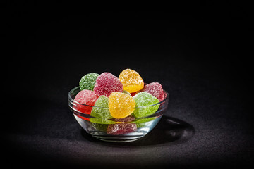 marmalade candies lie in a glass bowl