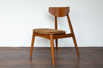 Vintage wooden chair on on wooden parquet floor.