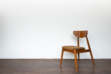 Vintage wooden chair on on wooden parquet floor.