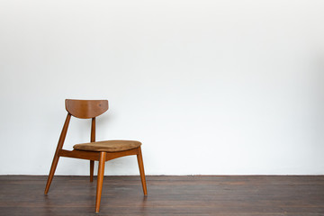 Vintage wooden chair on on wooden parquet floor.