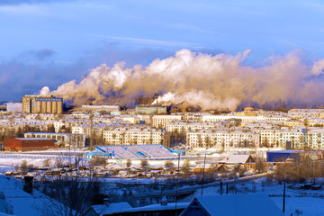 Environmental problem of environmental pollution and air in large cities. Smog over the city. Technological emissions of metallurgical plant