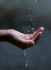Palm hands with water splash © AbdulRazak