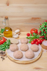 Zrazy on a wooden board with vegetables