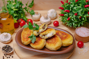 Naklejka na ściany i meble Pies on a wooden board with potato and mushrooms