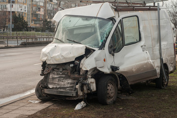 Fototapeta na wymiar Crushed in car accident transport van