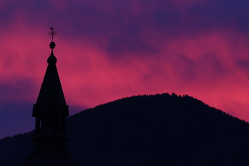 Pink sky with church tower