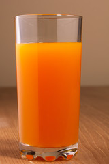Multifruit juice is poured into a glass