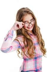 Smiling cute little girl child teen in eyeglasses education, school and vision concept