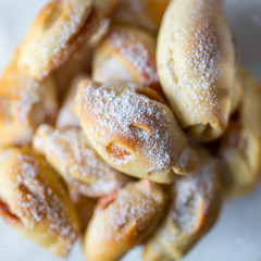 homemade sweet cakes filled with jam from rolled out yeast dough