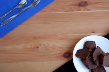 Brownie cakes, on a wooden background