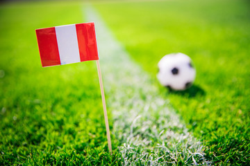 Obraz premium Peru national Flag and football ball on green grass. Fans, support photo, edit space