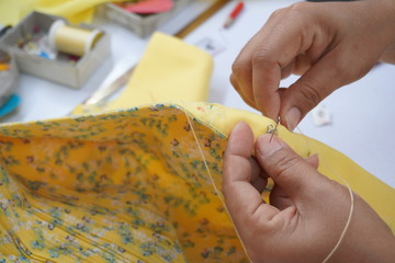 Asian women are sewing and designing