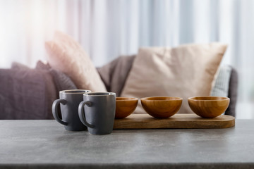 Table background of free space and blurred interior with window. 