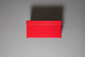 Fototapeta na wymiar Red Shoe Box Mockup isolated on gray with clipping path.High resolution photo.