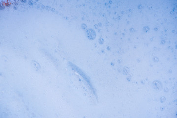 Abstract background white soapy foam texture. Shampoo foam with bubbles