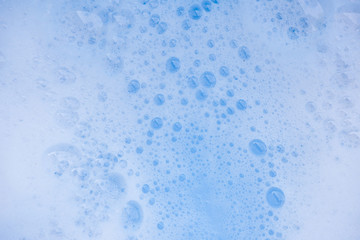 Abstract background white soapy foam texture. Shampoo foam with bubbles