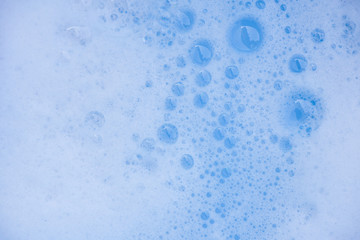 Abstract background white soapy foam texture. Shampoo foam with bubbles