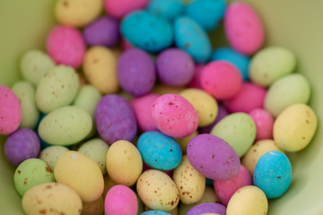 Fototapeta na wymiar Assortment of colorful eggs in a bowl