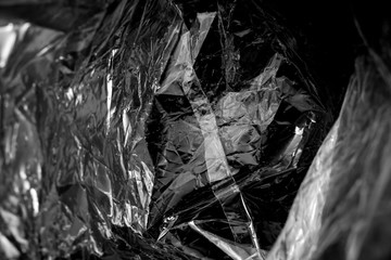 Inside the white plastic bag on a black background