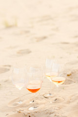glasses of wine on the beach