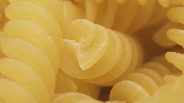 Macro shot of spiral shaped pasta. Italian Fusilli pasta, macaroni