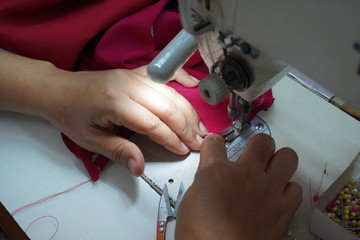 Asian women are sewing and designing