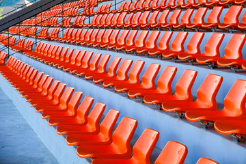 Orange Chairs in stadium for watching sport.